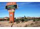 View of the Anthem shopping center sign on a sunny day with a Chevron gas station and blue sky at 3407 W Steinbeck Dr, Anthem, AZ 85086