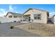 Low maintenance backyard with desert landscaping, gravel, and block wall at 40005 W Rio Lobo Dr, Maricopa, AZ 85138