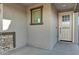 Charming front porch area featuring stone accents, desert landscaping, and an inviting entrance at 40005 W Rio Lobo Dr, Maricopa, AZ 85138