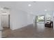 Open living area showcasing tile flooring, access to the backyard, and natural light at 40005 W Rio Lobo Dr, Maricopa, AZ 85138