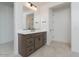 Modern bathroom featuring a wood vanity, white countertop, and tiled flooring at 40101 N Alameda Dr, San Tan Valley, AZ 85140