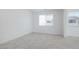 Bright, open bedroom with neutral paint and tile at 40101 N Alameda Dr, San Tan Valley, AZ 85140