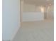 A bright, carpeted hallway with white walls and trim showcases a clean and open space at 40101 N Alameda Dr, San Tan Valley, AZ 85140