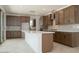 Modern kitchen features a large island, ample storage, stainless appliances, and neutral backsplash at 40101 N Alameda Dr, San Tan Valley, AZ 85140