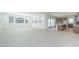 Spacious living room with abundant natural light, neutral floors, and open layout at 40101 N Alameda Dr, San Tan Valley, AZ 85140