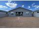 The home's backyard features a large open space awaiting personalized landscaping at 4329 E Brook Lynn Pl, San Tan Valley, AZ 85143