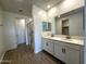 Elegant bathroom showcasing dual sinks, modern lighting, and a luxurious glass shower at 4329 E Brook Lynn Pl, San Tan Valley, AZ 85143