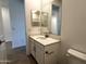 Well-lit bathroom featuring a modern vanity with a sink, quartz countertops, and stylish fixtures at 4329 E Brook Lynn Pl, San Tan Valley, AZ 85143