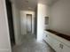 Bathroom area featuring white cabinets and door leading to a shower and toilet area at 4329 E Brook Lynn Pl, San Tan Valley, AZ 85143