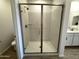 Well-lit glass-enclosed shower in bathroom with modern fixtures and tiled flooring at 4329 E Brook Lynn Pl, San Tan Valley, AZ 85143