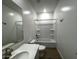 Clean bathroom with quartz countertops, white cabinets, and a shower-tub combo at 4329 E Brook Lynn Pl, San Tan Valley, AZ 85143