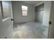 Cozy bedroom with a walk-in closet, window, and neutral walls at 4329 E Brook Lynn Pl, San Tan Valley, AZ 85143