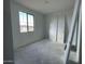 Bedroom with a window offering neighborhood views and a closet with bi-fold doors at 4329 E Brook Lynn Pl, San Tan Valley, AZ 85143