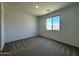 Cozy bedroom with neutral carpet, a window for natural light, and a calming atmosphere at 4329 E Brook Lynn Pl, San Tan Valley, AZ 85143