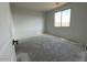 A bright bedroom with a large window providing ample natural light at 4329 E Brook Lynn Pl, San Tan Valley, AZ 85143