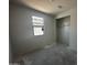 Bedroom with a window and a closet ready for storage, set against neutral walls and flooring at 4329 E Brook Lynn Pl, San Tan Valley, AZ 85143