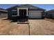 Charming single-story home featuring a two-car garage and a welcoming front entrance at 4329 E Brook Lynn Pl, San Tan Valley, AZ 85143