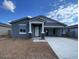 Charming single-story home featuring a welcoming porch and a two-car driveway at 4329 E Brook Lynn Pl, San Tan Valley, AZ 85143
