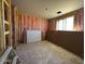 Interior view of a home under construction with unfinished flooring and pink insulation at 4329 E Brook Lynn Pl, San Tan Valley, AZ 85143