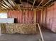 Interior view of a home under construction with wood framing and pink insulation at 4329 E Brook Lynn Pl, San Tan Valley, AZ 85143
