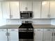 Well-equipped kitchen boasts stainless steel appliances and ample cabinet space at 4329 E Brook Lynn Pl, San Tan Valley, AZ 85143
