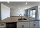 An open kitchen offers a center island, recessed lighting, and modern fixtures at 4329 E Brook Lynn Pl, San Tan Valley, AZ 85143