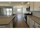 Modern kitchen featuring stainless steel appliances, countertops, and ample cabinet space at 4329 E Brook Lynn Pl, San Tan Valley, AZ 85143