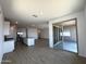 Open-concept kitchen with a center island, stainless steel appliances, and backyard patio access at 4329 E Brook Lynn Pl, San Tan Valley, AZ 85143