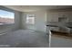 Bright, partially installed kitchen with window, island, and neutral walls and flooring at 4329 E Brook Lynn Pl, San Tan Valley, AZ 85143