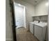 Convenient laundry room with washer, dryer, and nearby access to other rooms at 4329 E Brook Lynn Pl, San Tan Valley, AZ 85143