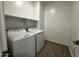 The laundry room features a washer, dryer, and ample shelf space at 4329 E Brook Lynn Pl, San Tan Valley, AZ 85143
