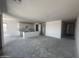 Spacious living area connected to the kitchen, with neutral walls and flooring at 4329 E Brook Lynn Pl, San Tan Valley, AZ 85143