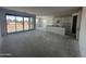 Open floor plan features sliding glass doors to the backyard, and a partially installed kitchen at 4329 E Brook Lynn Pl, San Tan Valley, AZ 85143