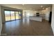 Open floor plan featuring a living area and kitchen with lots of natural light at 4329 E Brook Lynn Pl, San Tan Valley, AZ 85143