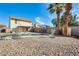 Spacious backyard featuring a refreshing private pool, rock landscaping and tall shade trees at 4343 E Contessa St, Mesa, AZ 85205