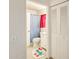 Bright bathroom with a light blue shower curtain, colorful rug, and a white vanity with a sink and storage at 4343 E Contessa St, Mesa, AZ 85205