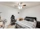 Bedroom with ceiling fan, gamer chair, and trunk at 4343 E Contessa St, Mesa, AZ 85205