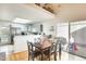 Cozy dining room flows into the gray kitchen with a breakfast bar and access to a covered patio at 4343 E Contessa St, Mesa, AZ 85205