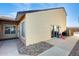 Home exterior with a covered patio, slider, and BBQ area, showcasing a relaxing outdoor living space at 4343 E Contessa St, Mesa, AZ 85205