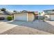 Inviting single-level home featuring a two-car garage, a low-maintenance rock yard, and private gated courtyard at 4343 E Contessa St, Mesa, AZ 85205