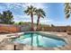 Inviting backyard pool surrounded by lush landscaping, perfect for outdoor enjoyment and relaxation at 4343 E Contessa St, Mesa, AZ 85205