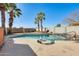 Sparkling pool area with palm trees, providing a tropical ambiance for relaxation and fun at 4343 E Contessa St, Mesa, AZ 85205