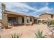 Beautiful backyard with desert landscaping, patio seating, and views at 4903 S Desert Willow Dr, Gold Canyon, AZ 85118