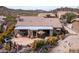 Expansive backyard patio with desert landscaping, perfect for outdoor entertaining and enjoying the serene desert lifestyle at 4903 S Desert Willow Dr, Gold Canyon, AZ 85118