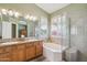 Bright bathroom with double vanity, soaking tub, and separate shower at 4903 S Desert Willow Dr, Gold Canyon, AZ 85118