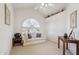 Bright room with vaulted ceiling, large window and closet, cozy love seat and side table at 4903 S Desert Willow Dr, Gold Canyon, AZ 85118