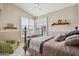 Charming bedroom with a four-poster bed, plantation shutters and neutral color scheme at 4903 S Desert Willow Dr, Gold Canyon, AZ 85118