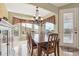 Bright dining room features wooden table, view, and chandelier at 4903 S Desert Willow Dr, Gold Canyon, AZ 85118