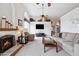 Cozy living room featuring a fireplace, high ceilings, and a large window with a scenic view at 4903 S Desert Willow Dr, Gold Canyon, AZ 85118