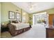 Spacious main bedroom features patio access, light green walls, and large windows at 4903 S Desert Willow Dr, Gold Canyon, AZ 85118